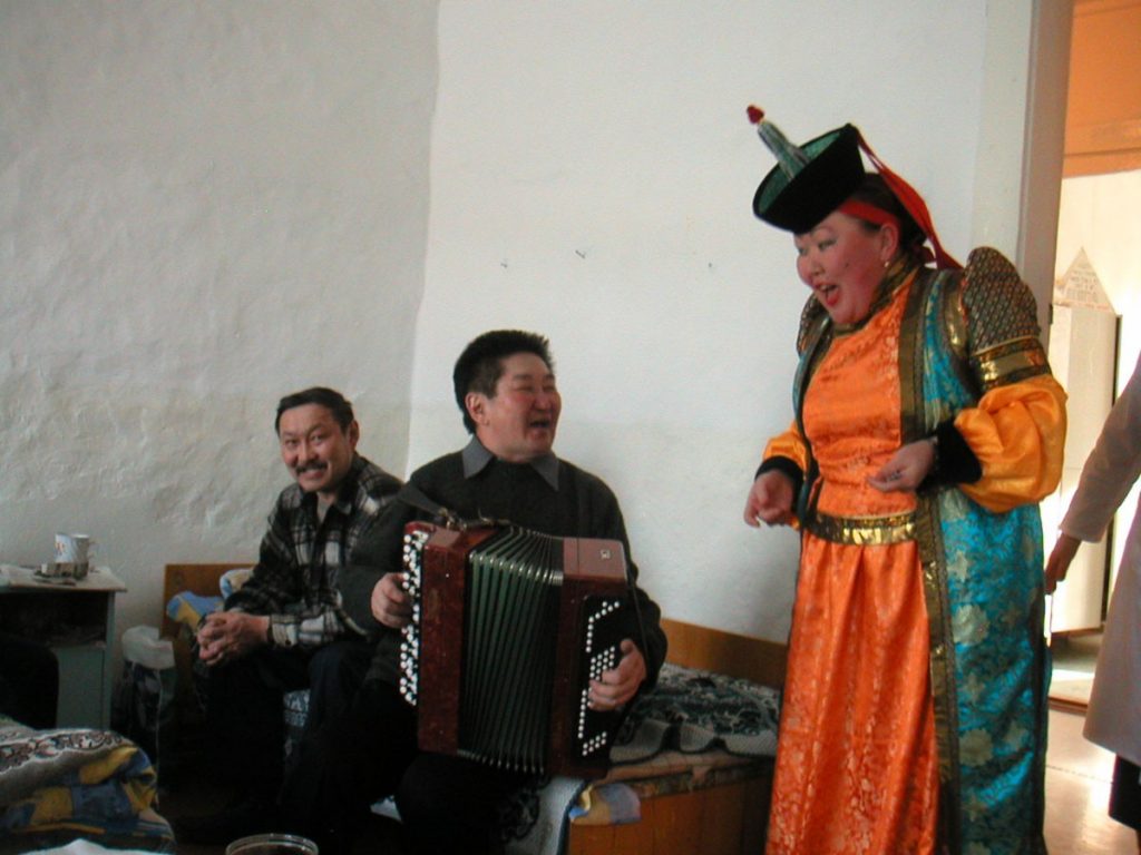 Dr. Zoua Samaeva, the Orlik Hospital director, in traditional dress, singing for the patients in the adult unit.